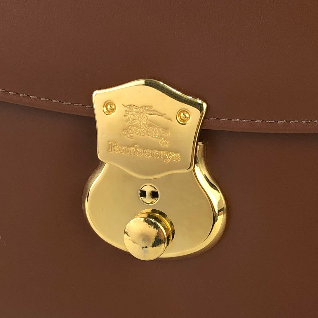 Burberrys Burberry front lock logo horse leather top handle handbag brown vintage old zkphv2