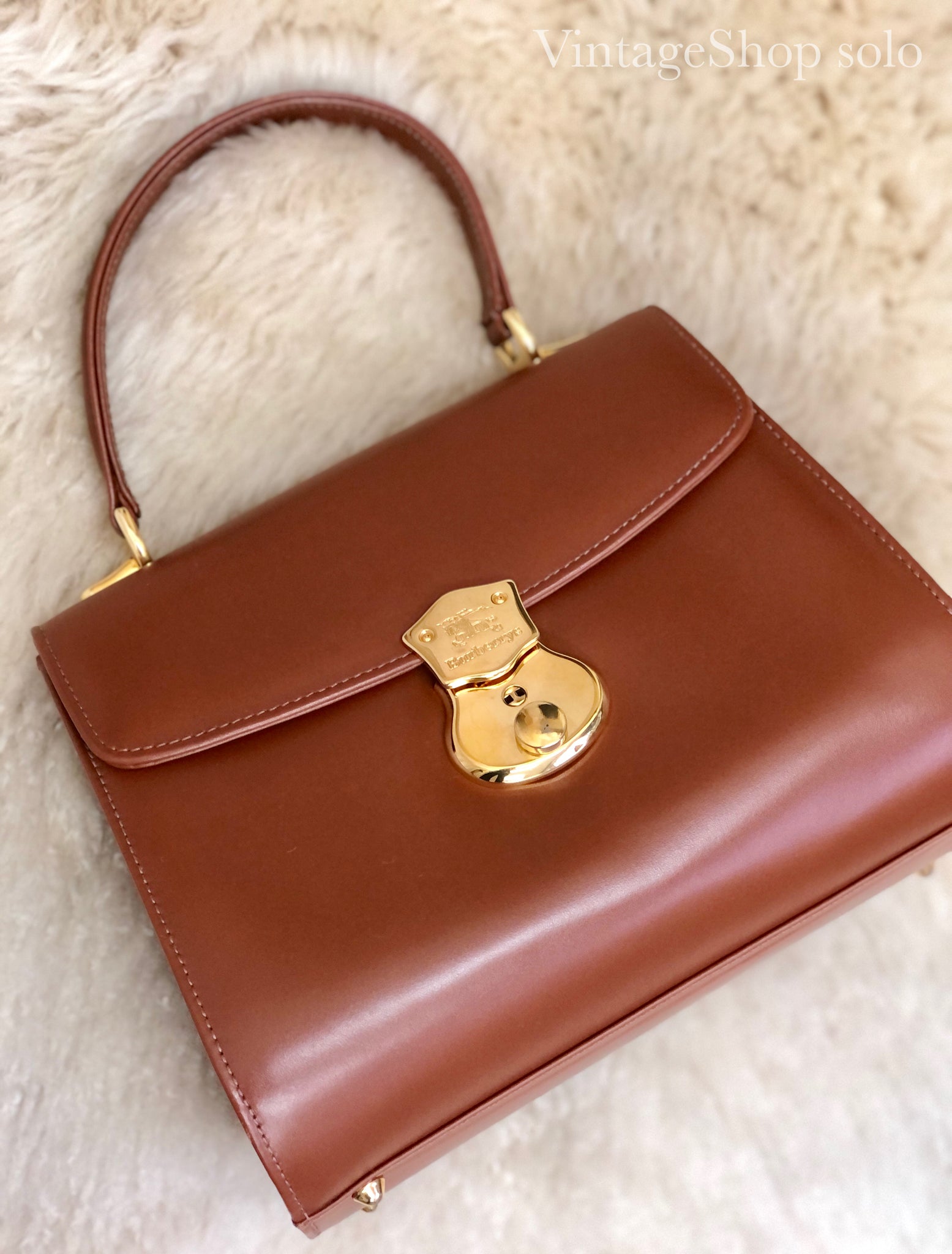 Burberrys Burberry front lock logo horse leather top handle handbag br –  VintageShop solo